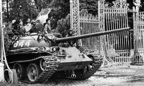 Vietnamese liberation forces tank crashes through the gates of the US Embassy in Saigon as liberation forces take the city from the US puppet regime after US forces left