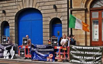 Information picket (with table across the road) organized by Anti-Internment Group of Ireland in September 2014 at Thomas St./ Meath St. junction, Dublin.  They returned there in December and in January supported a picket in Cork, handing out leaflets on the Craigavon Two injustice.