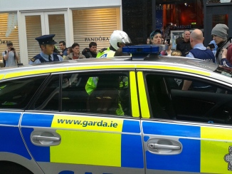 Some in crowd beginning to argue with Gardaí as others look on amazed